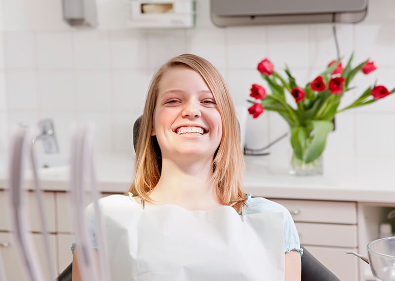 Woman Sitting In A Dental Chair